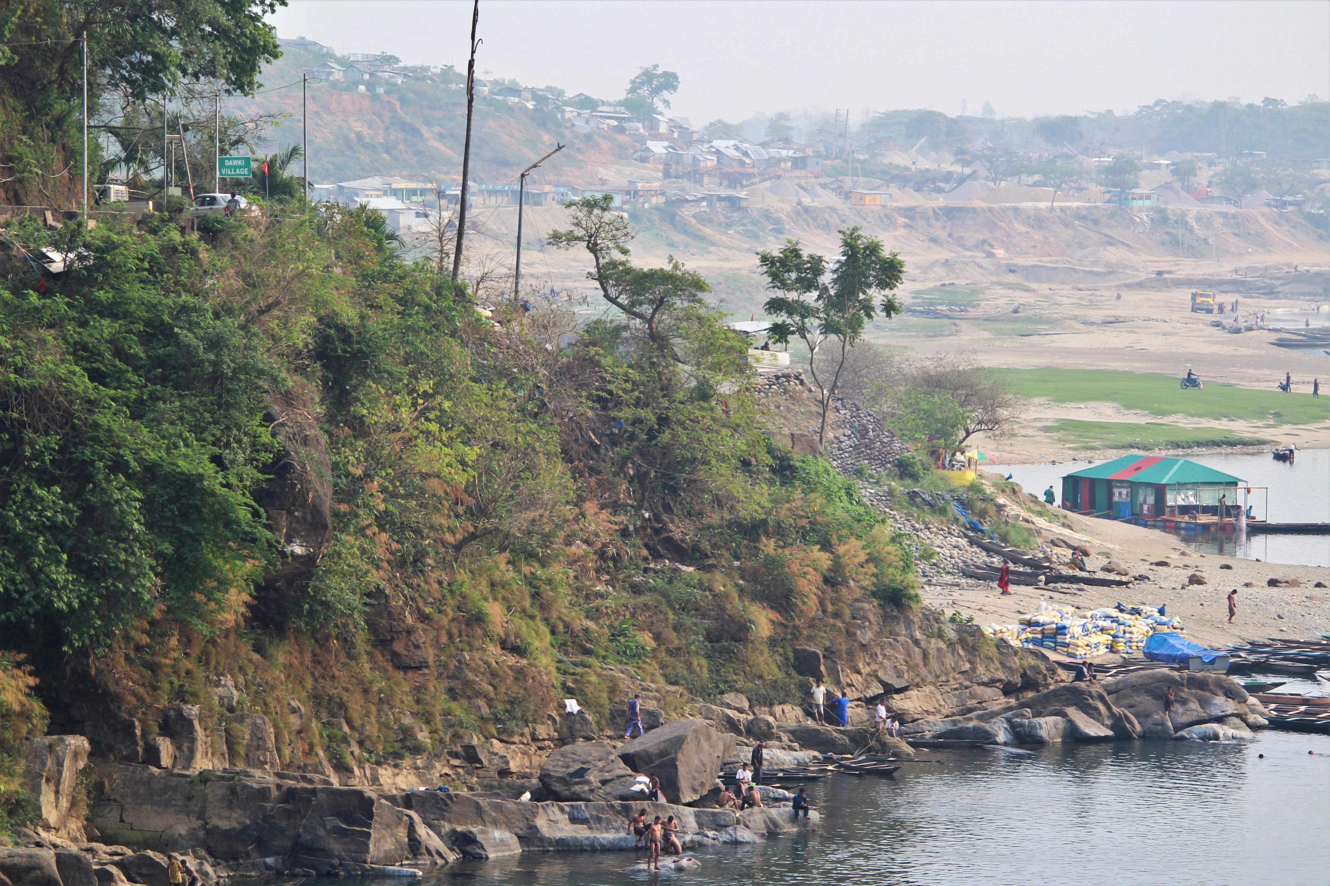 The Indo-Bangladesh Border. The Bangladesh check-post can be identified as the roof is painted with similar colour as that of the national flag of the country